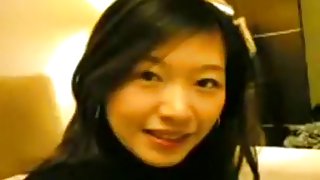 Asian girl sucks cock, gets missionary fucked and rides her bf.