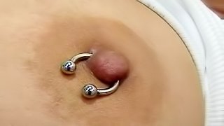 Dark-haired mature with piercing is fucking her puss