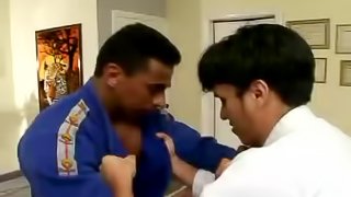 After a martial arts bout these two hung studs fuck on the floor
